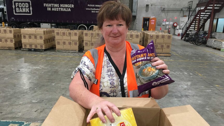 Connie Williams packing food hampers
