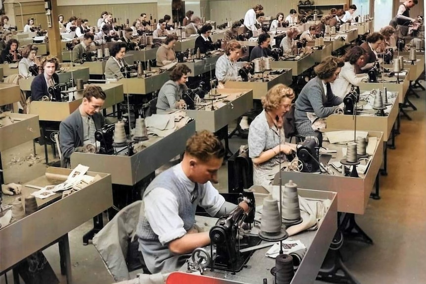 Employees sewing on a factory floor