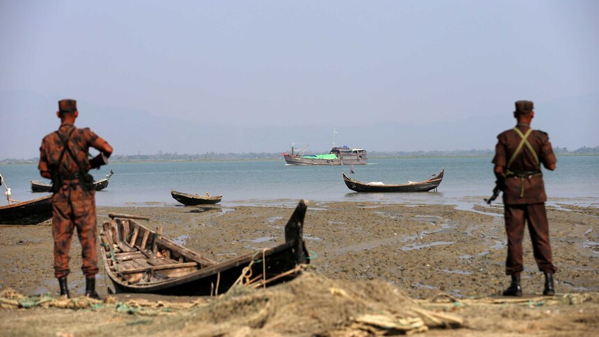 Members of Border Guard Bangladesh (BGB) stand guard on the bank of Naf River.