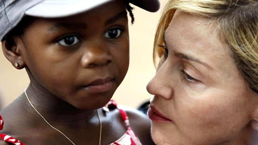 US pop star Madonna holds her adopted Malawian child Mercy James