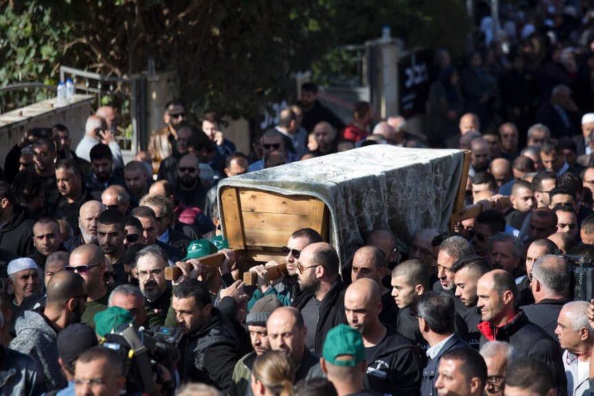 Relatives and friends carry the casket of Israeli Arab student Aiia Maasarwe during her funeral procession.