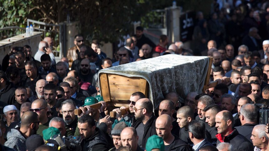 Relatives and friends carry the casket of Israeli Arab student Aiia Maasarwe during her funeral procession.