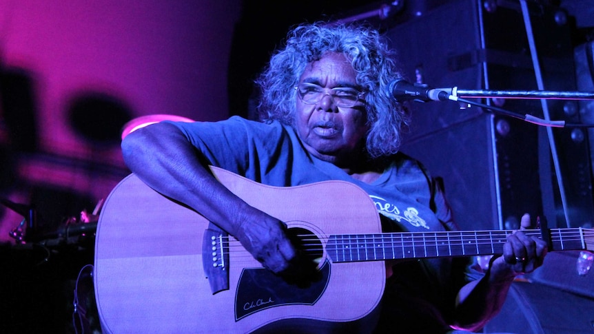 Olive Knight on stage with her guitar during the Desert Feet tour