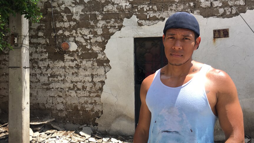 Naun Valladares outside his earthquake-wrecked home