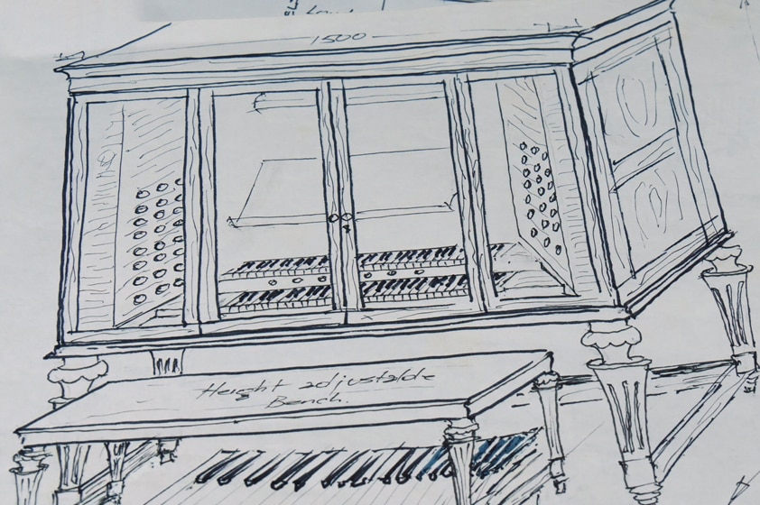 Black and white sketch of the keyboard part of a pipe organ.