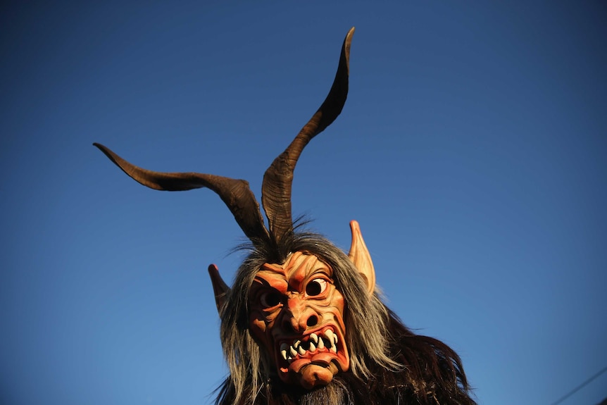 A member of the Haiminger Krampusgruppe arrives prior to the annual Krampus night in Tyrol, Austria.