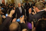 US vice president Joe Biden talks with reporters in the halls of the US Senate.