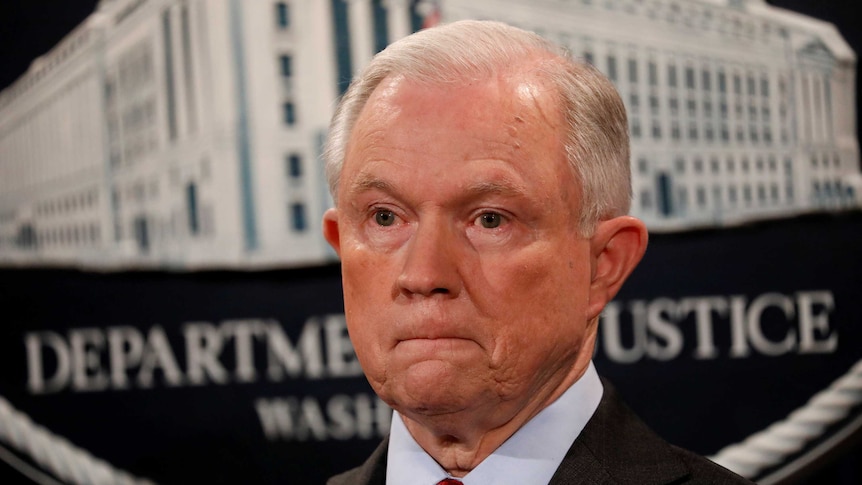 US Attorney General Jeff Sessions looks on during a news conference.