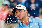 Tough outing ... Jason Day plays a bunker shot on the seventh hole during the second round