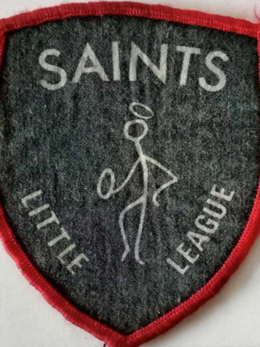 An iron-on patch which says 'Saints Little League'.