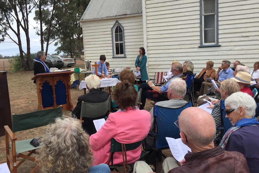 A crowd attending an outdoor church service