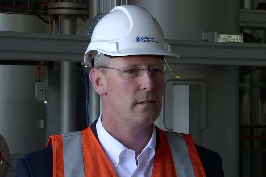 Dan van Holst Pellekaan wearing a white helmet and orange vest