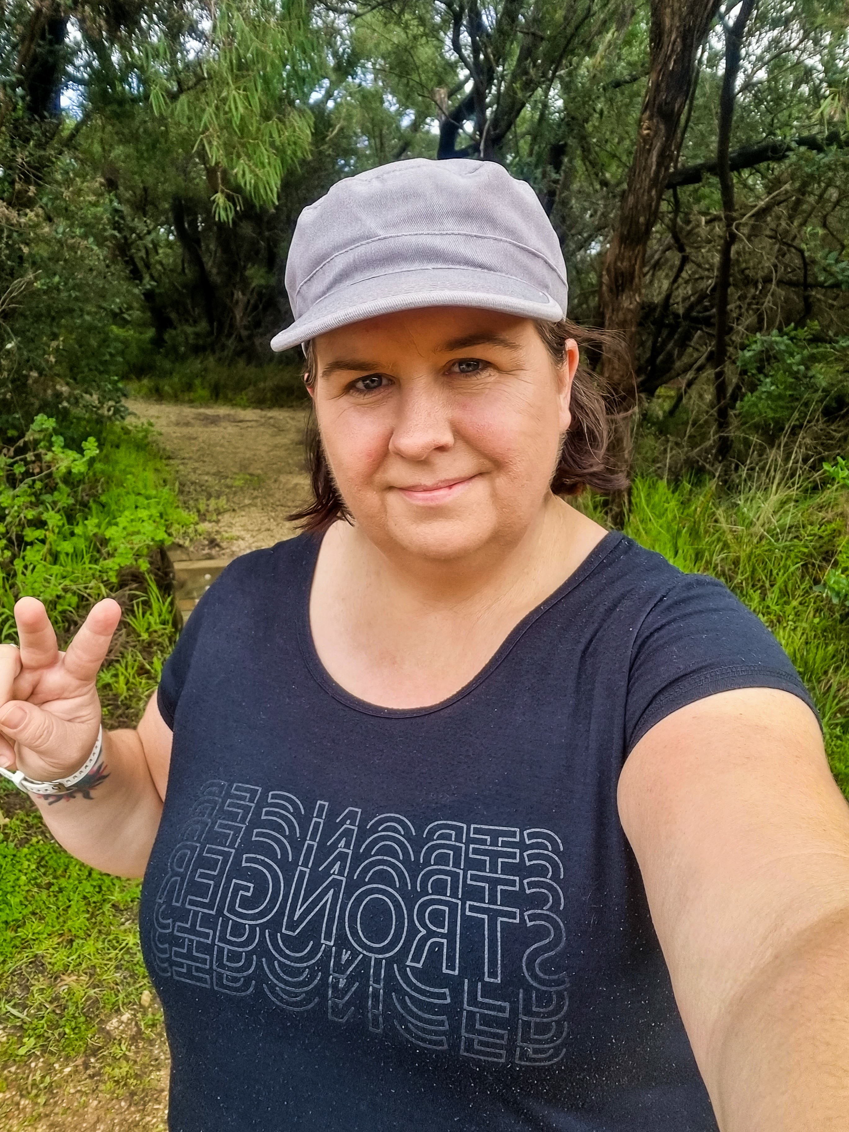 A woman giving peace sign