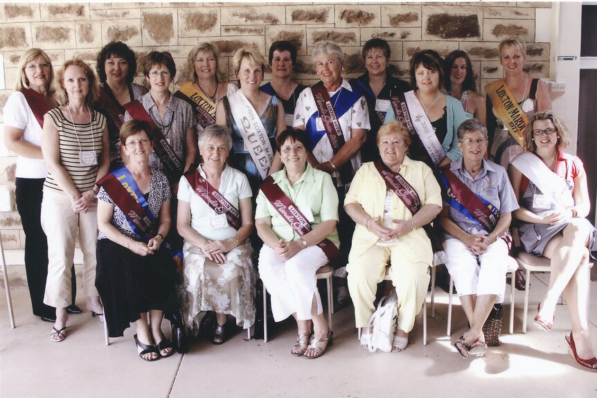 A reunion of Mardi Gras queens at the festival's 50th anniversary.