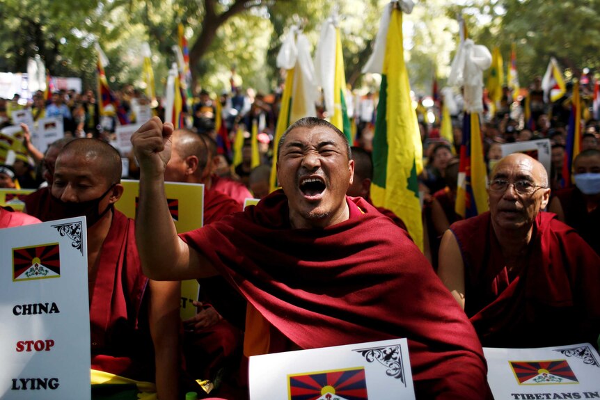 Tibetans monks protest in New Delhi to mark the 60th anniversary of the 1959 uprising.