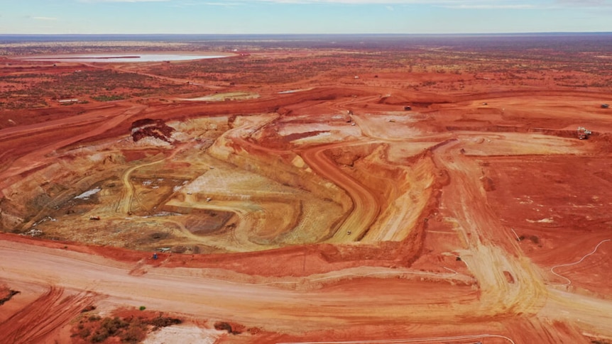 An aerial photograph of an open pit mine. 