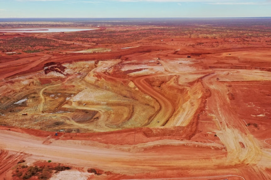 An aerial photograph of an open pit mine. 