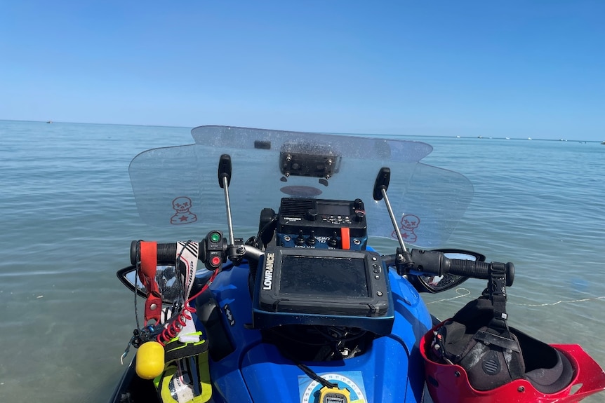 A jetski with a blue ocean in the background