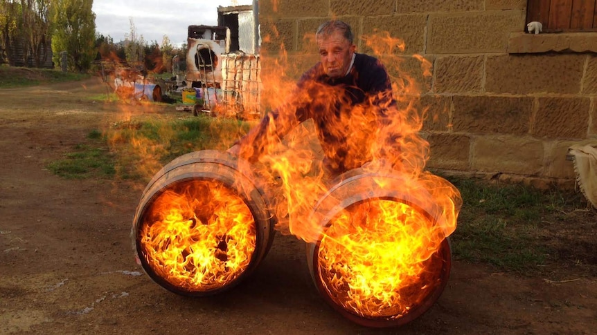 Peter Bignell burning barrels in preparation for his whisky.