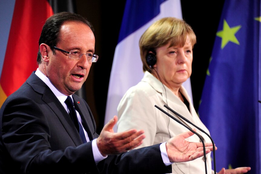 Angela Merkel and Francois Hollande meet at the German Chancellery in Berlin.