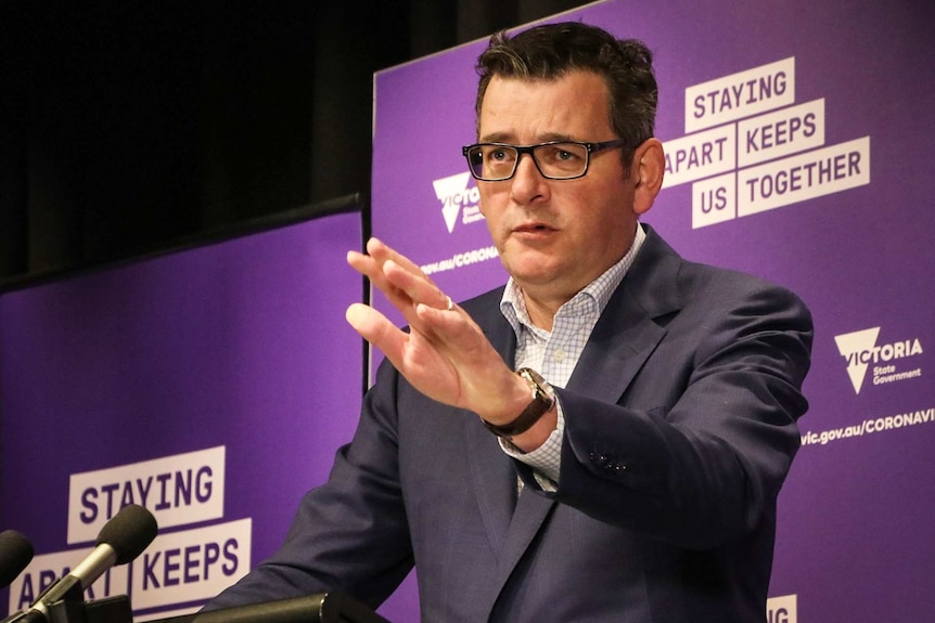 Victorian Premier Daniel Andrews gestures during a press conference.