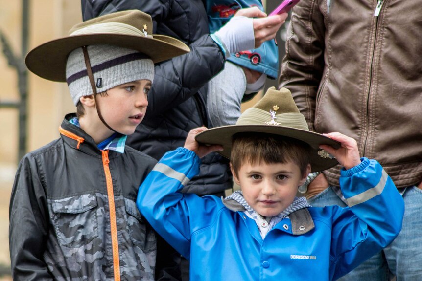 Boys in slouch hats wait for the Hobart Anzac parade.