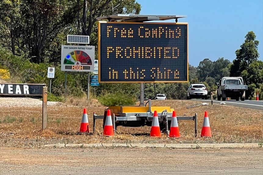 An electric sign deterring free camping