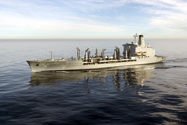 The USNS Walter S Diehl is pictured on a clear day at sea in calm waters.