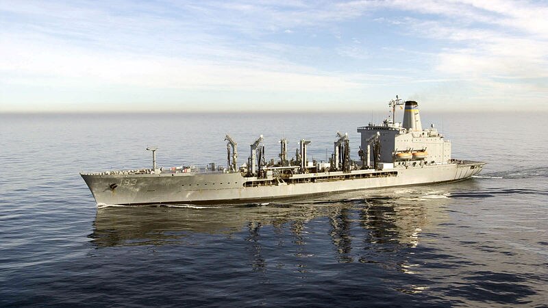 The USNS Walter S Diehl is pictured on a clear day at sea in calm waters.