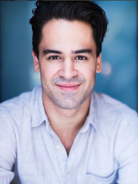 A headshot of Ryan Gonzales smiling at the camera.