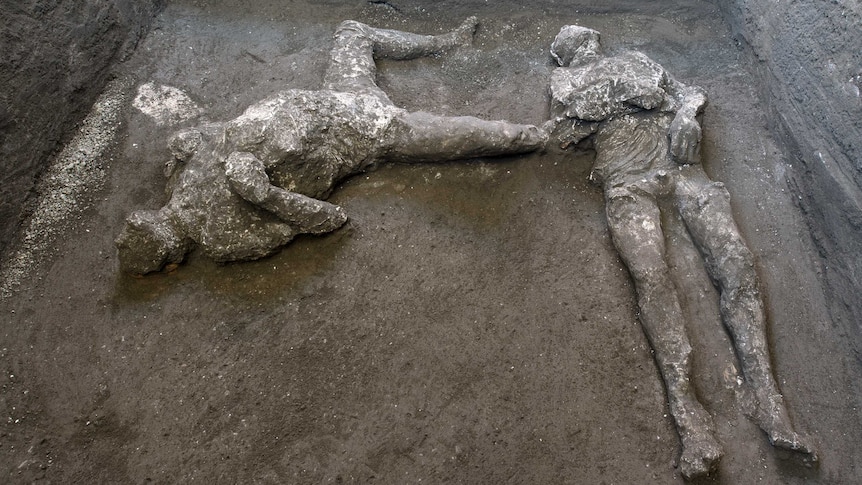 The casts of what are believed to have been a rich man and his male slave lay on the floor of an underground room.