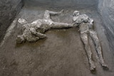 The casts of what are believed to have been a rich man and his male slave lay on the floor of an underground room.