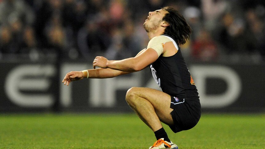 Troy Menzel reacts to missing a goal for Carlton