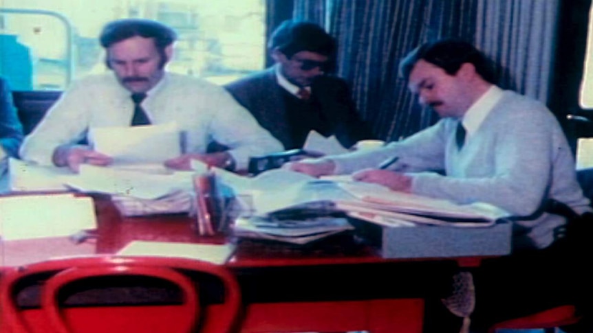 Detectives spread files out across a desk in Maria James' house.