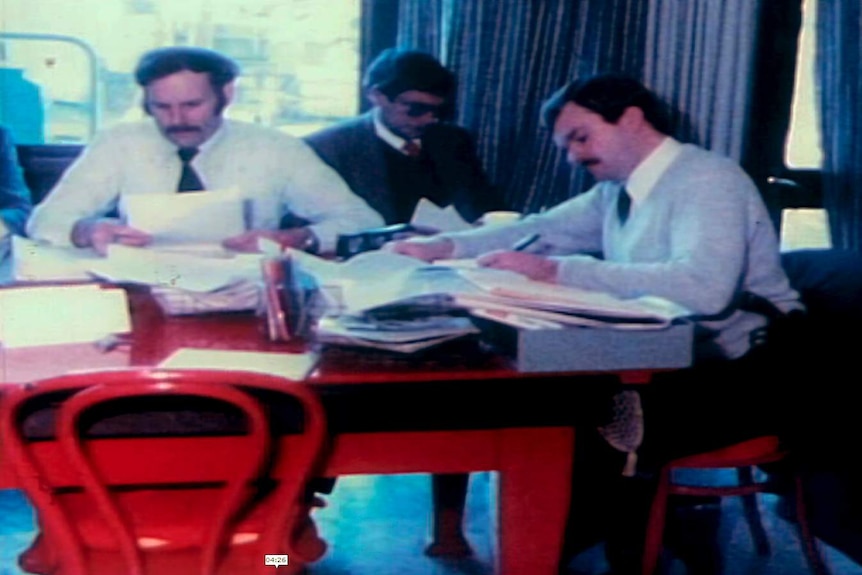 Detectives spread files out across a desk in Maria James' house.