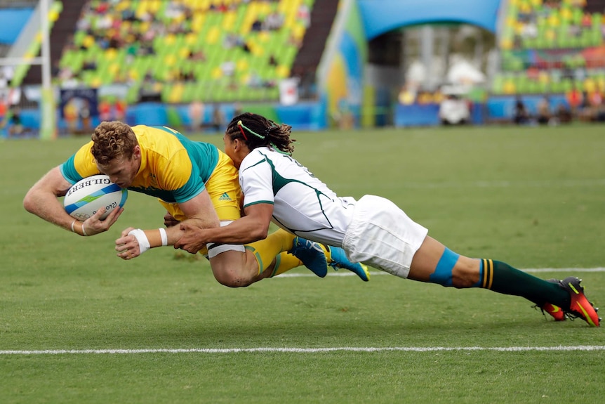 Australia's Tom Cusack scores a try against South Africa in the Olympic rugby sevens in Rio.