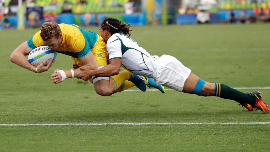 Australia's Tom Cusack scores a try against South Africa in the Olympic rugby sevens in Rio.