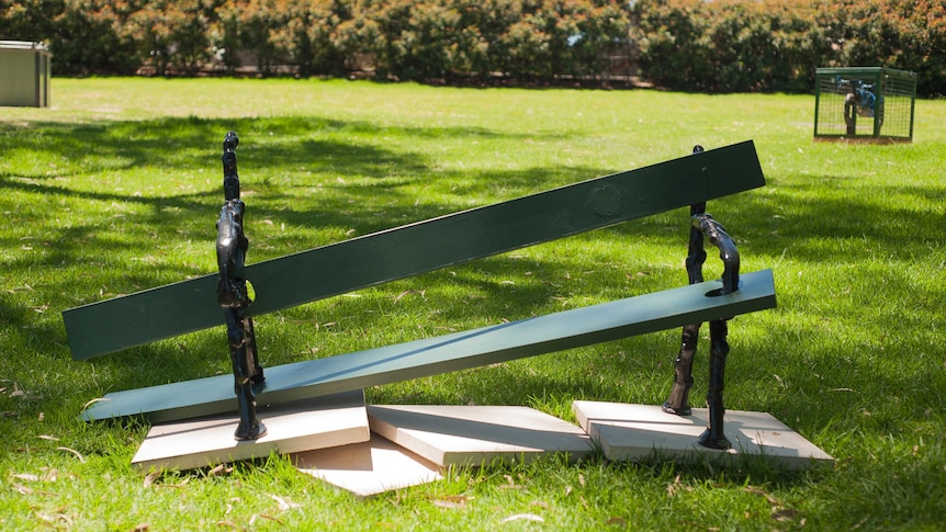 The artwork, Bnech by Roy Anada, looks like a reconstructed, mixed-up, version of a park bench.