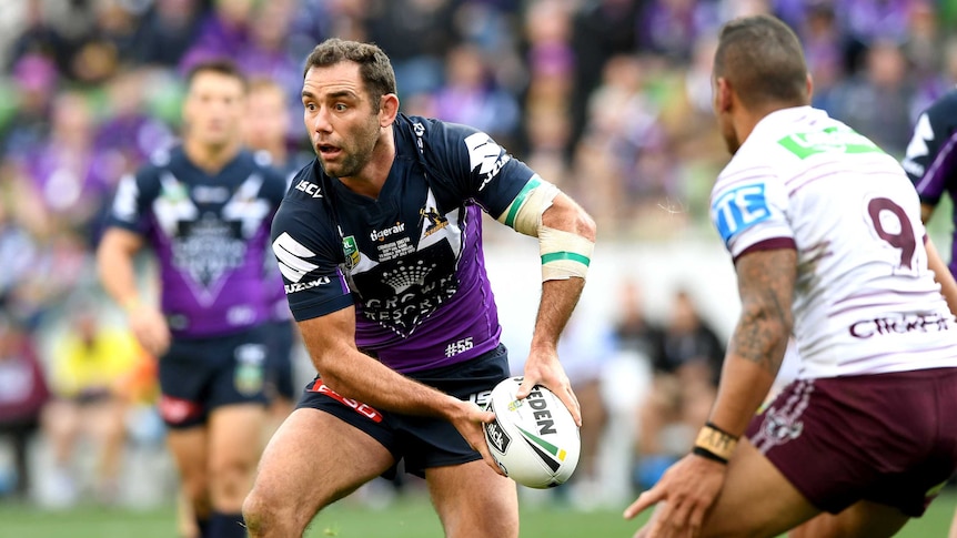 Cameron Smith of the Storm passes the ball.