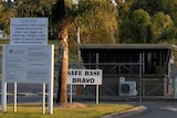 The front gates at the Holsworthy Barracks are guarded by unarmed security contractors.