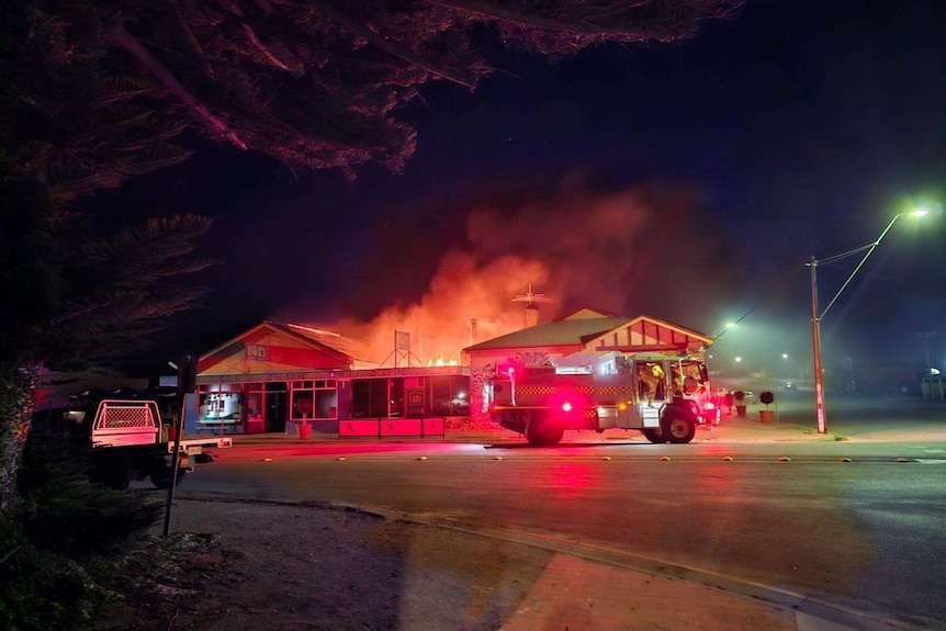 Fire engulfs a building.