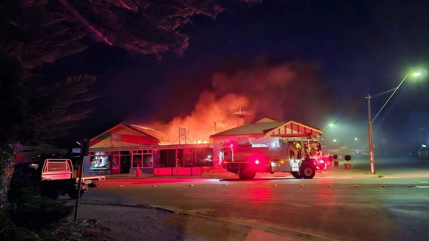 Fire engulfs a building.