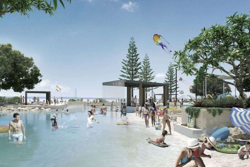 People are splashing in a pool built on the foreshore.