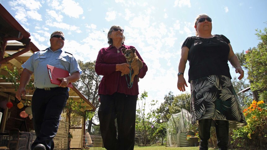 Doug Van Bavel (L) and Selina Young (R)of DFES with property owner Joan Last-Kelly