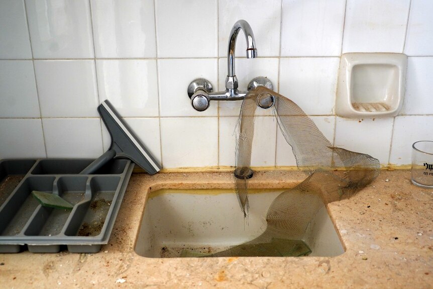 A sink with debris in it