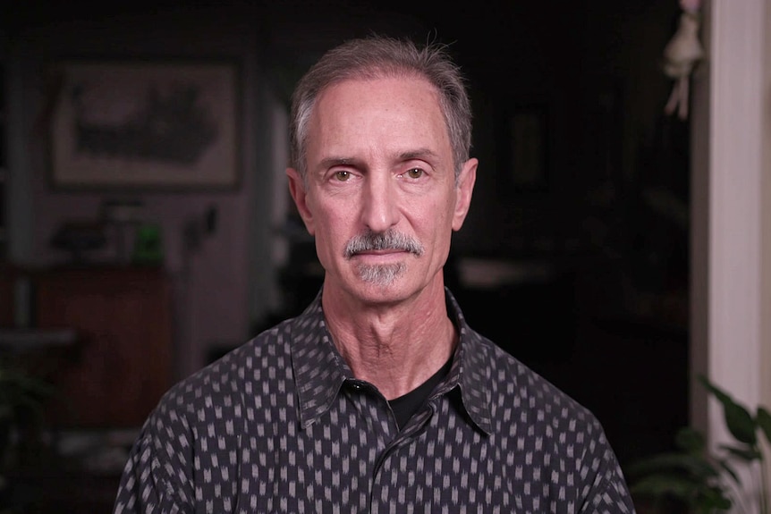 A man wearing a collared shirt.