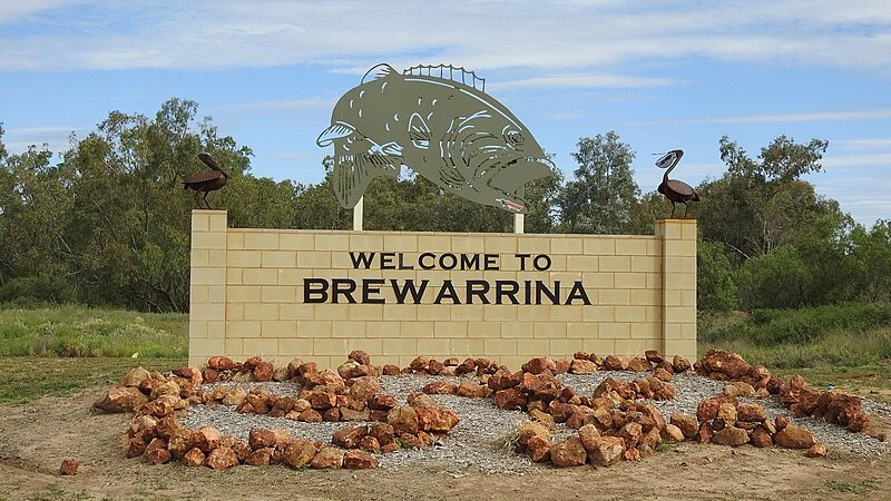 Sign that says welcome to Brewarrina, Murray Cod sculpture on top of sign
