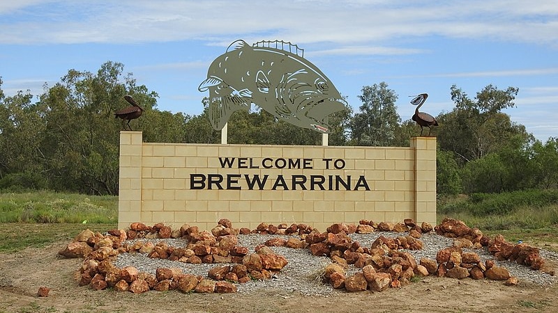 Sign that says welcome to Brewarrina, Murray Cod sculpture on top of sign