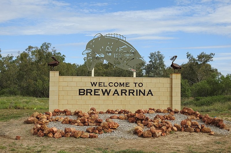 Sign that says welcome to Brewarrina, Murray Cod sculpture on top of sign