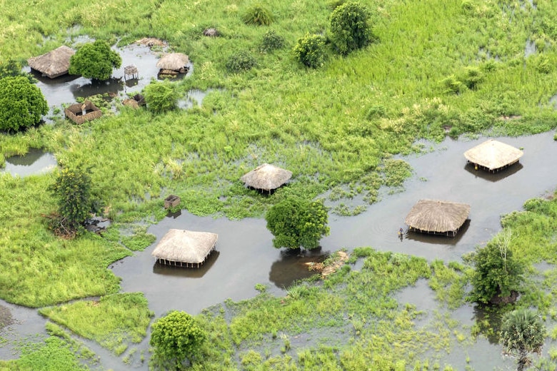 Rising waters threaten homes on the flooded Zambezi river in Mozambique